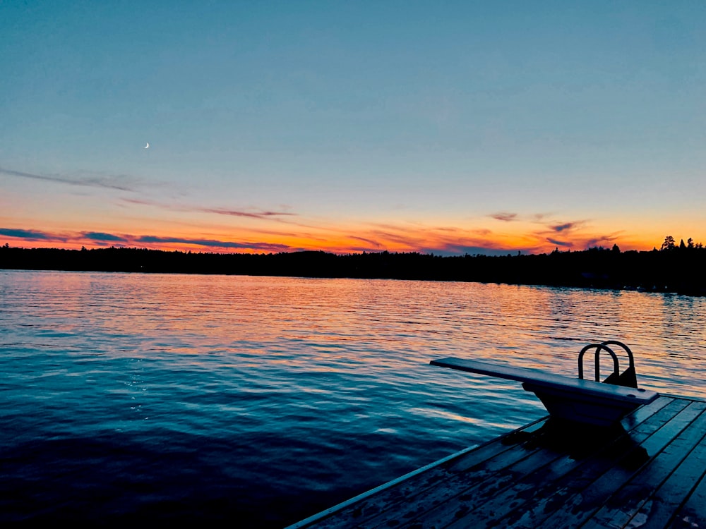 a boat sitting on top of a wooden dock