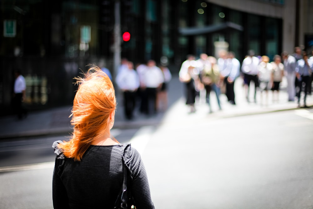 selective focus photography of woman in black top