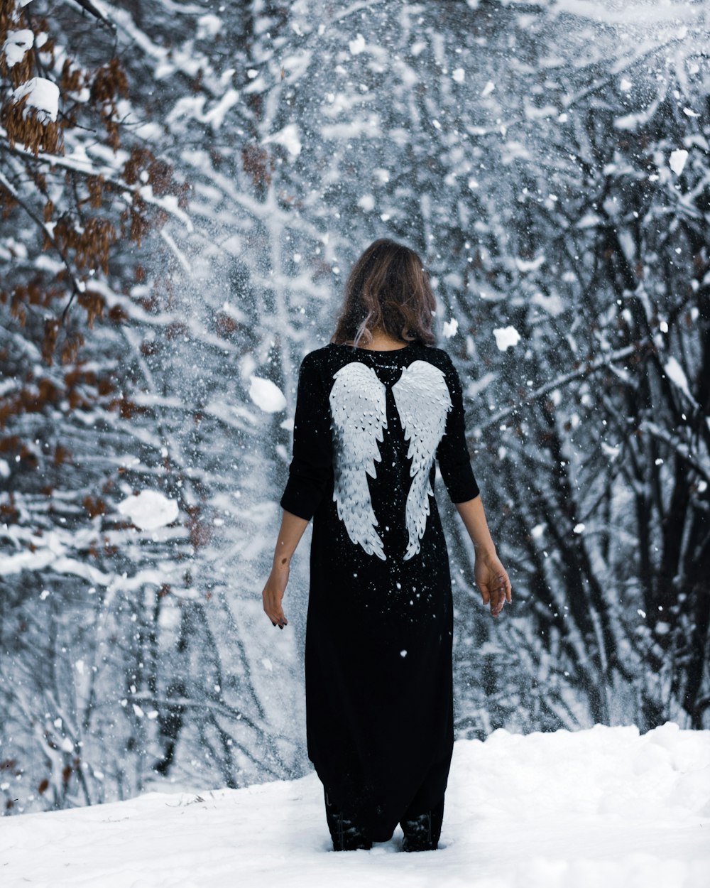 selective focus photography of woman near trees