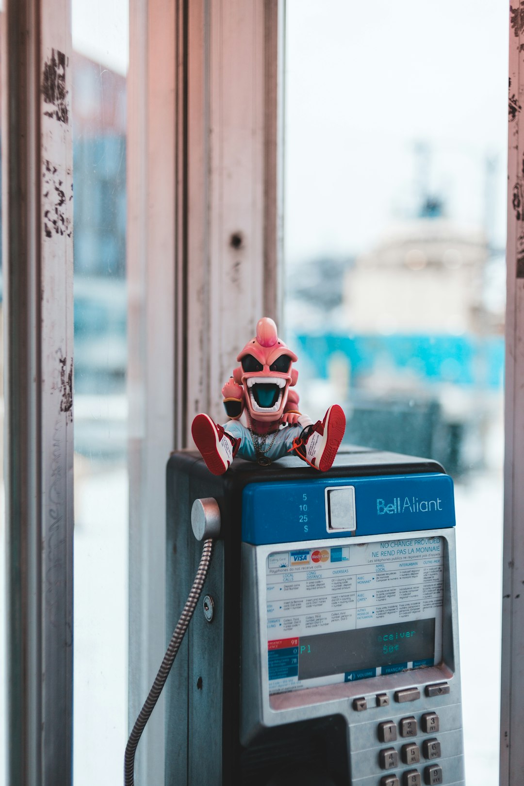 Majinboo figurine on payphone