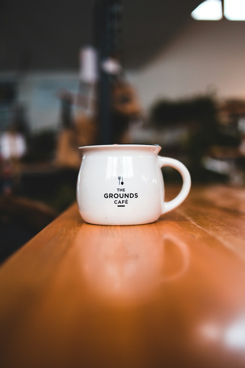 white mug on table