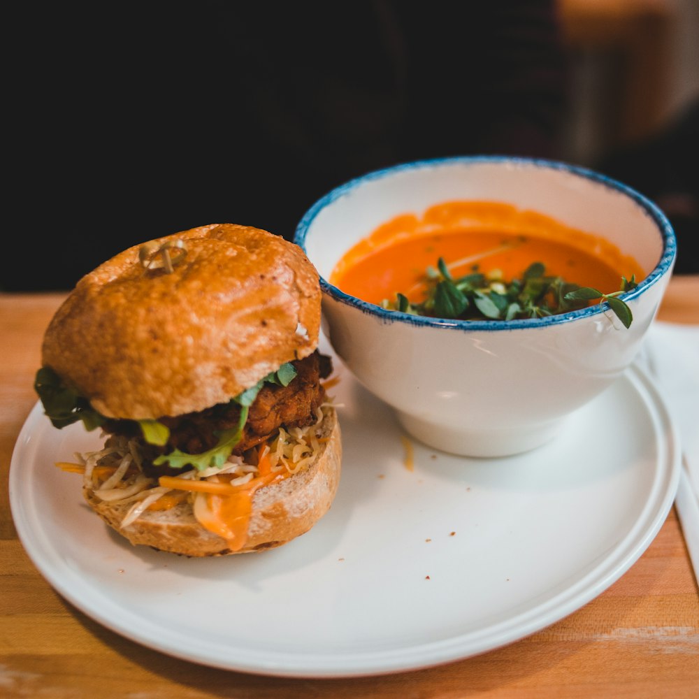 hamburger beside bowl of food