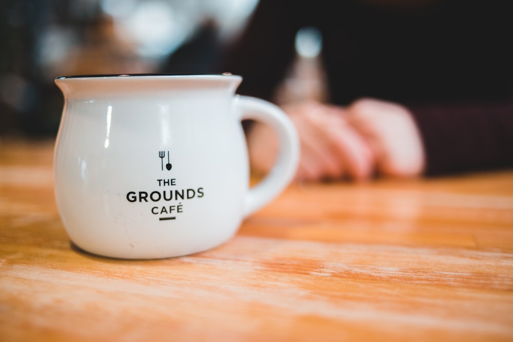 white with the grounds cafe ceramic mug