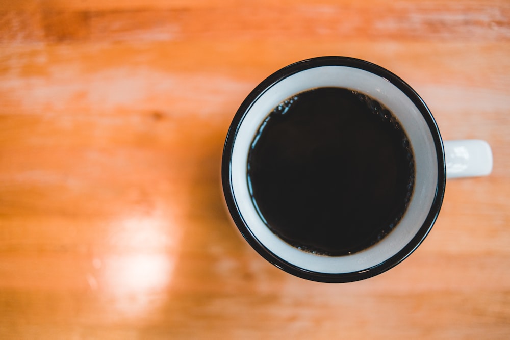 black coffee in white and black mug