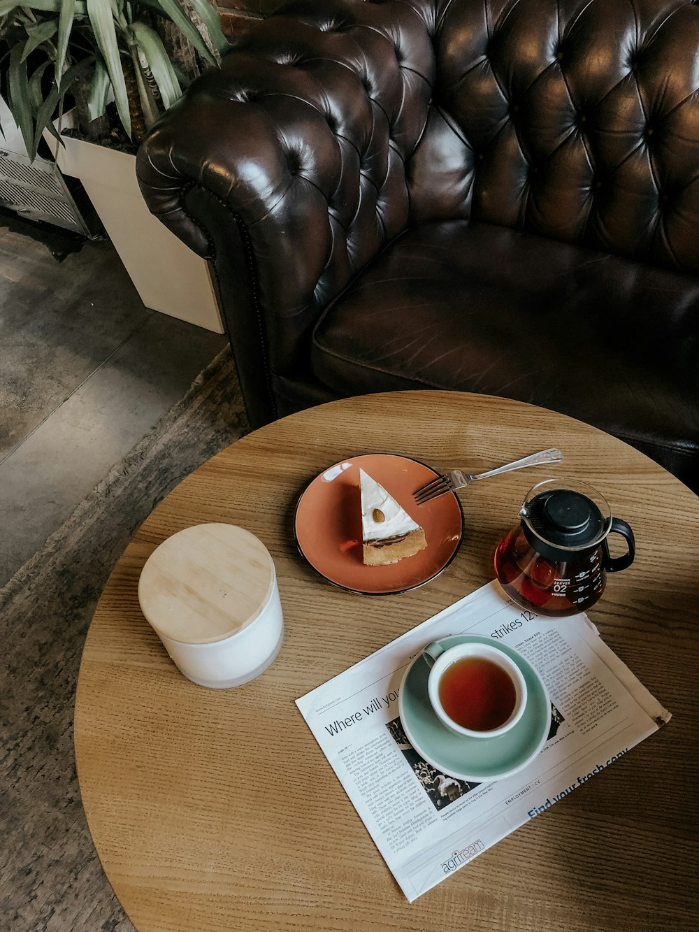 round brown ceramic plate on round wooden table