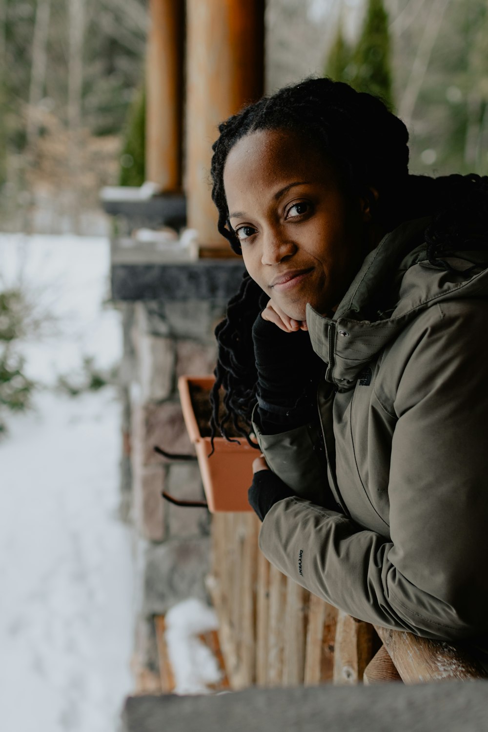 woman leaning over a wooden railing