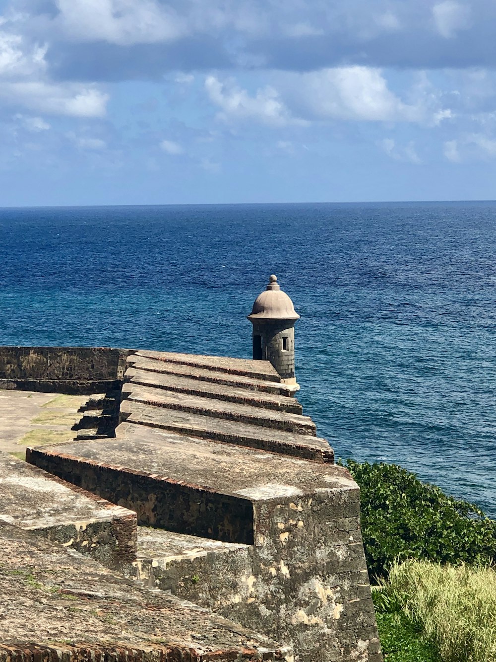 gray concrete structure near sea