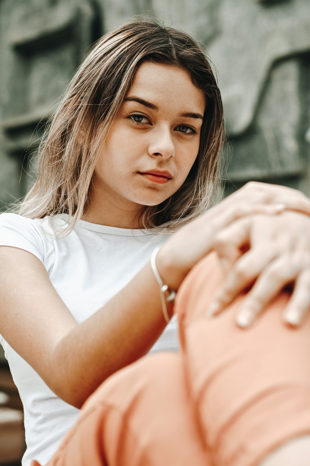 shallow focus photo of woman in white crew-neck T-shirt