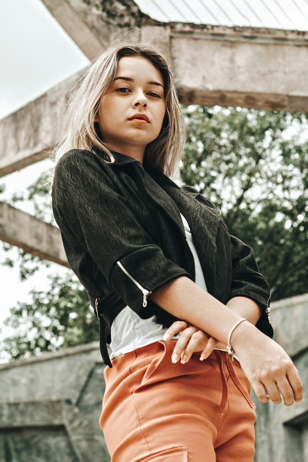 woman in black jacket and brown bottoms