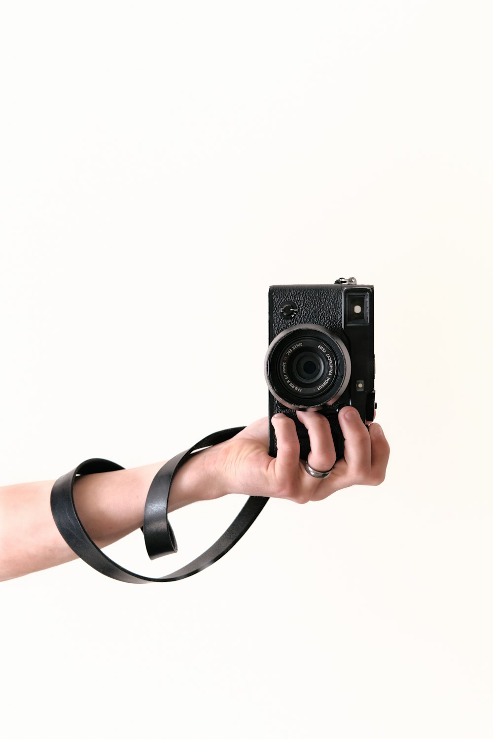 person holding black DSLR camera
