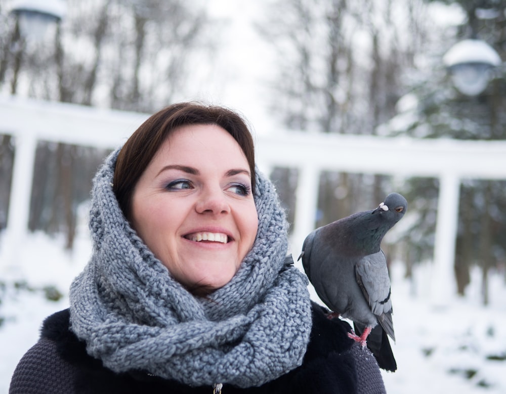 smiling woman wearing grey scarf