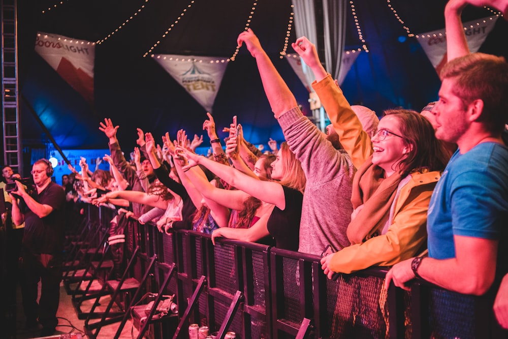 crowd of people fronting a stage