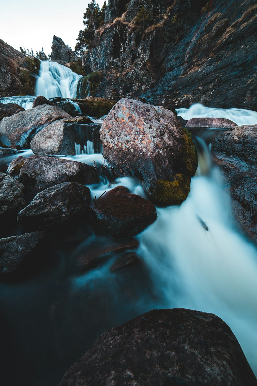 time-lapse photography of flowing multi-tier waterfall