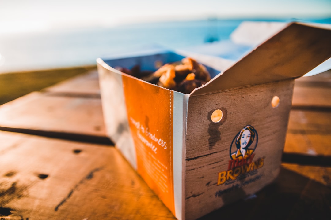 food in box on brown wooden table