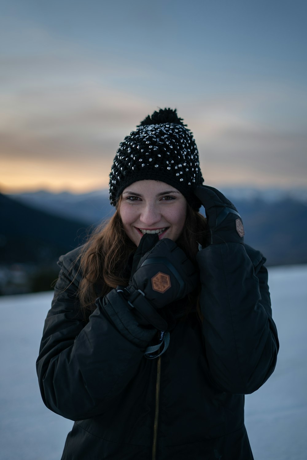 woman smiling on snowfield during day