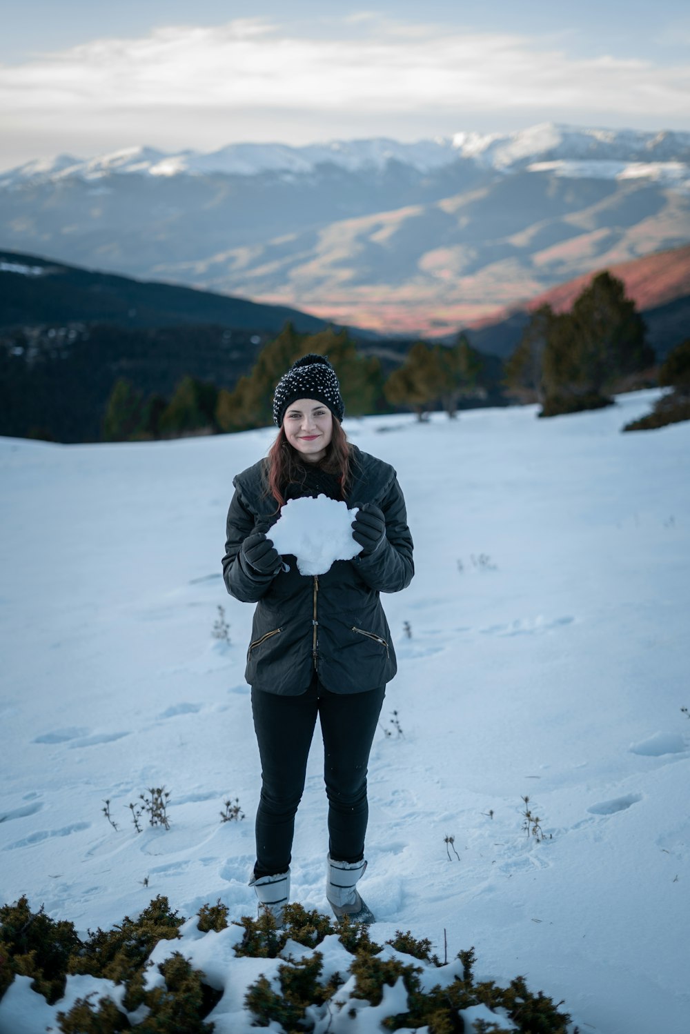 woman holding white snow