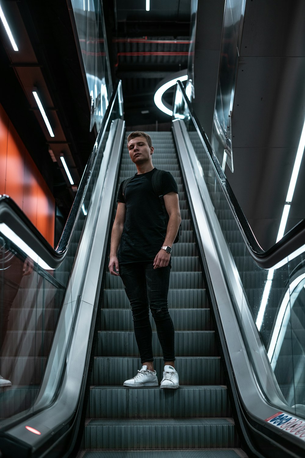 man standing on the escalator photograph