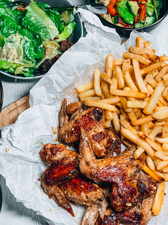 The Proper Wings: six crispy fried chicken wings with a side