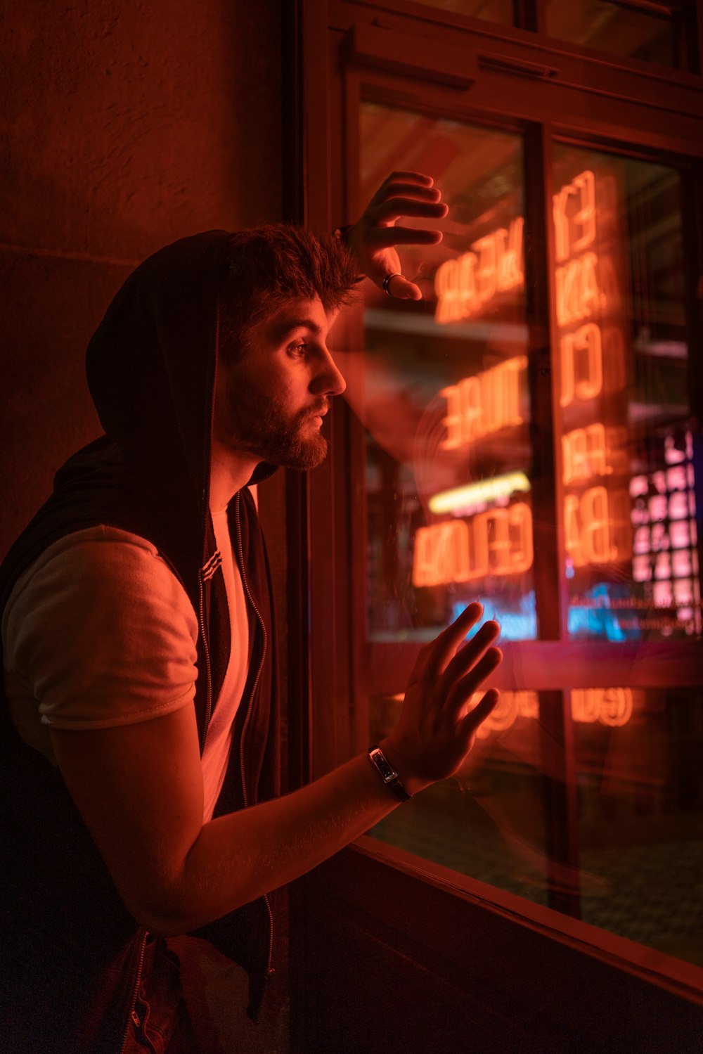 shallow focus photo of man in white and black short-sleeved hoodie