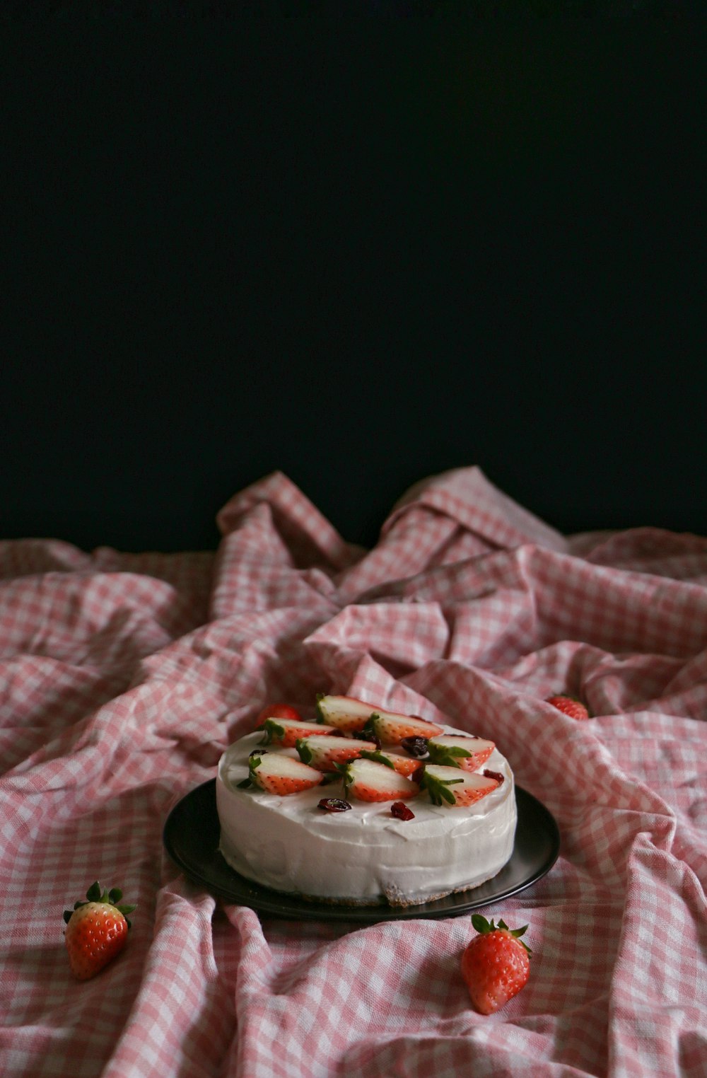 a cake sitting on top of a black plate