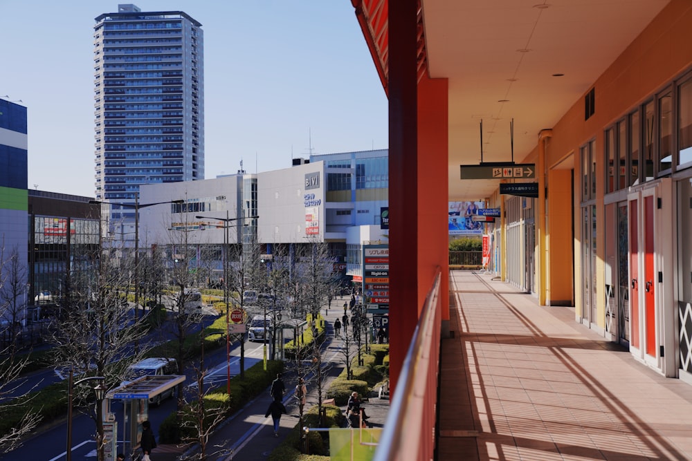 top-view photography of buildings and streets from a building hallway