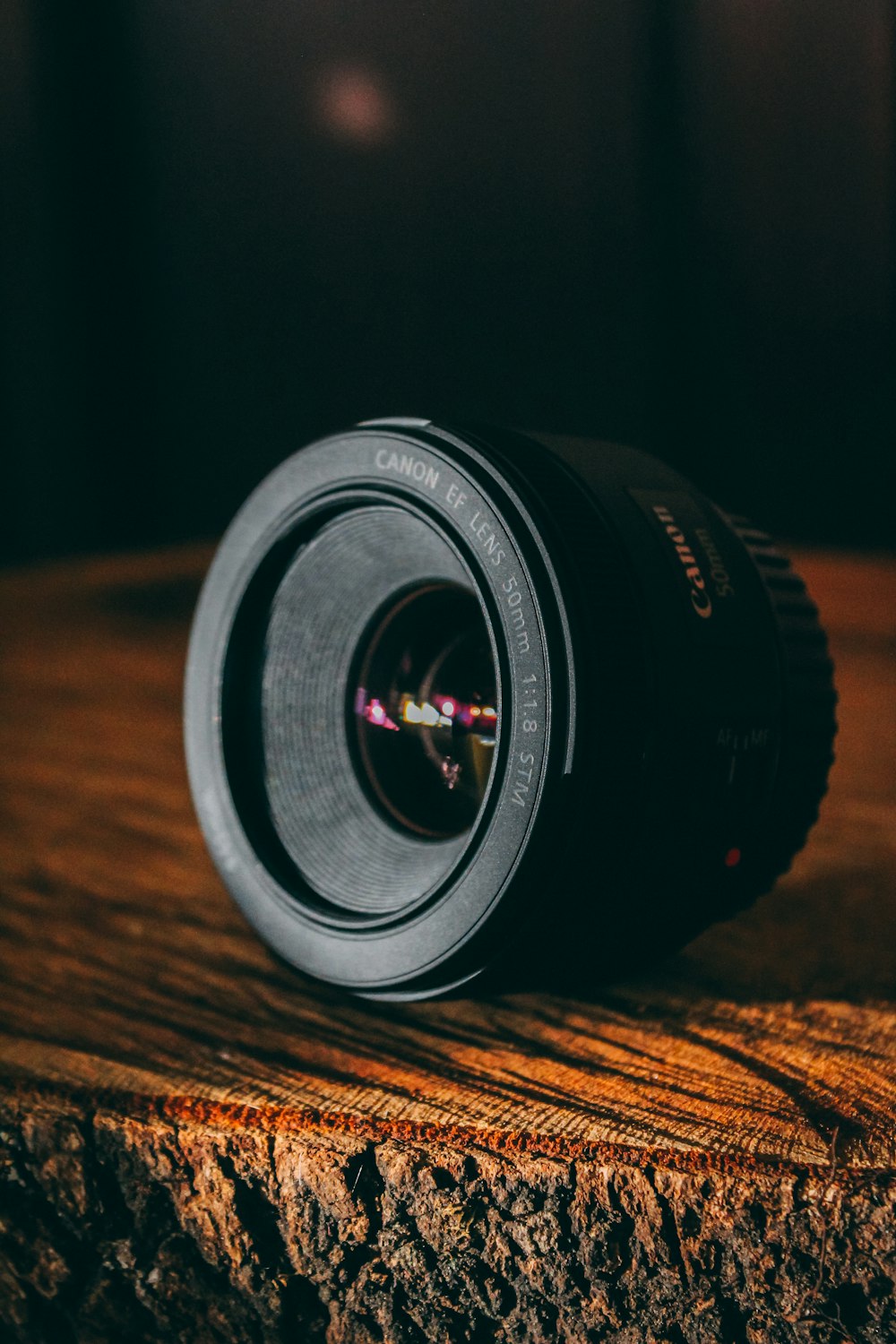 shallow focus photo of black Canon DSLR camera lens