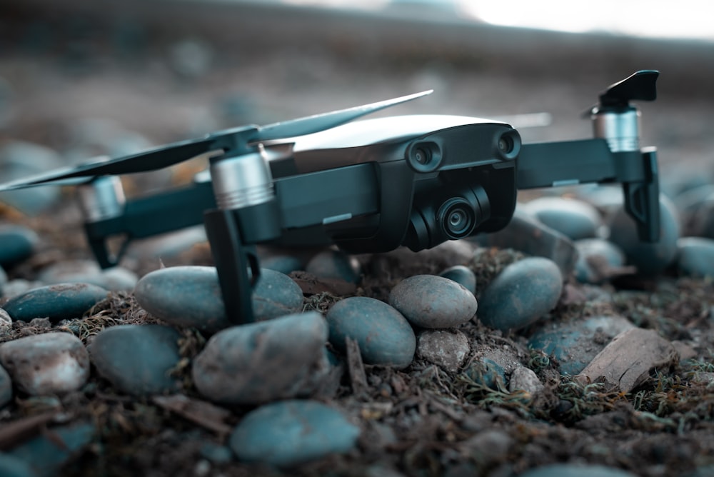 shallow focus photo of black quadcopter drone