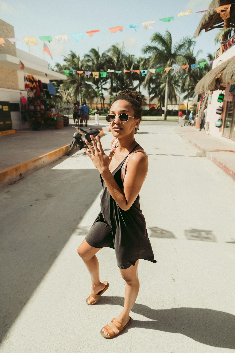 woman in black sleeveless dress