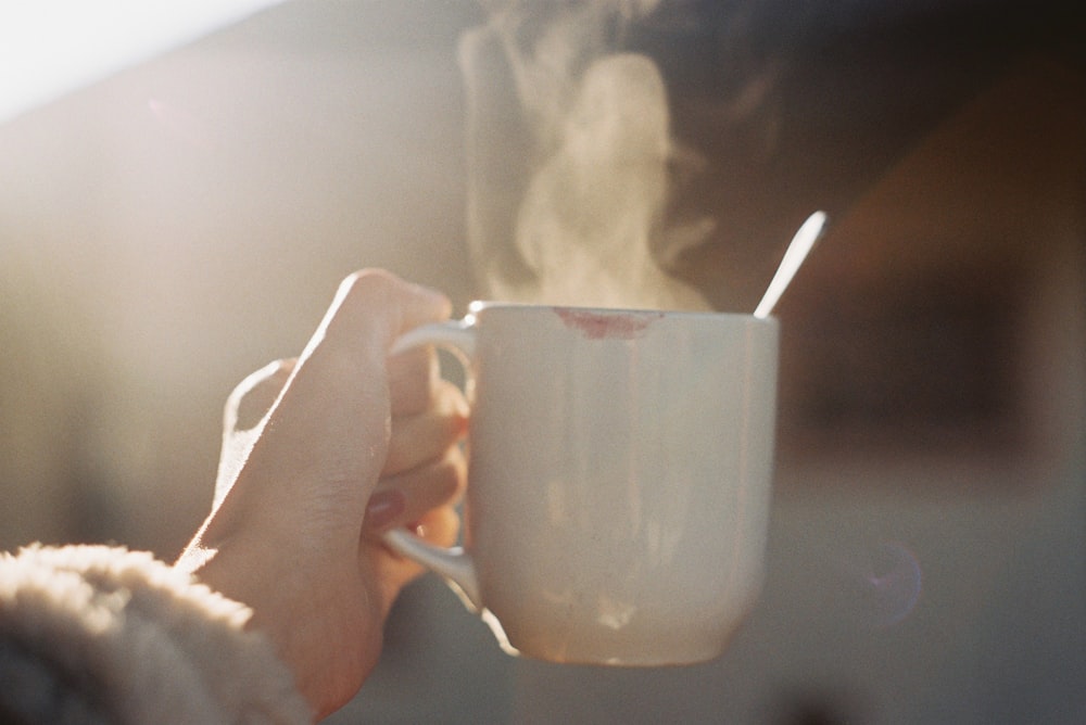 time-lapse photography of smoke from a white ceramic coffee mug