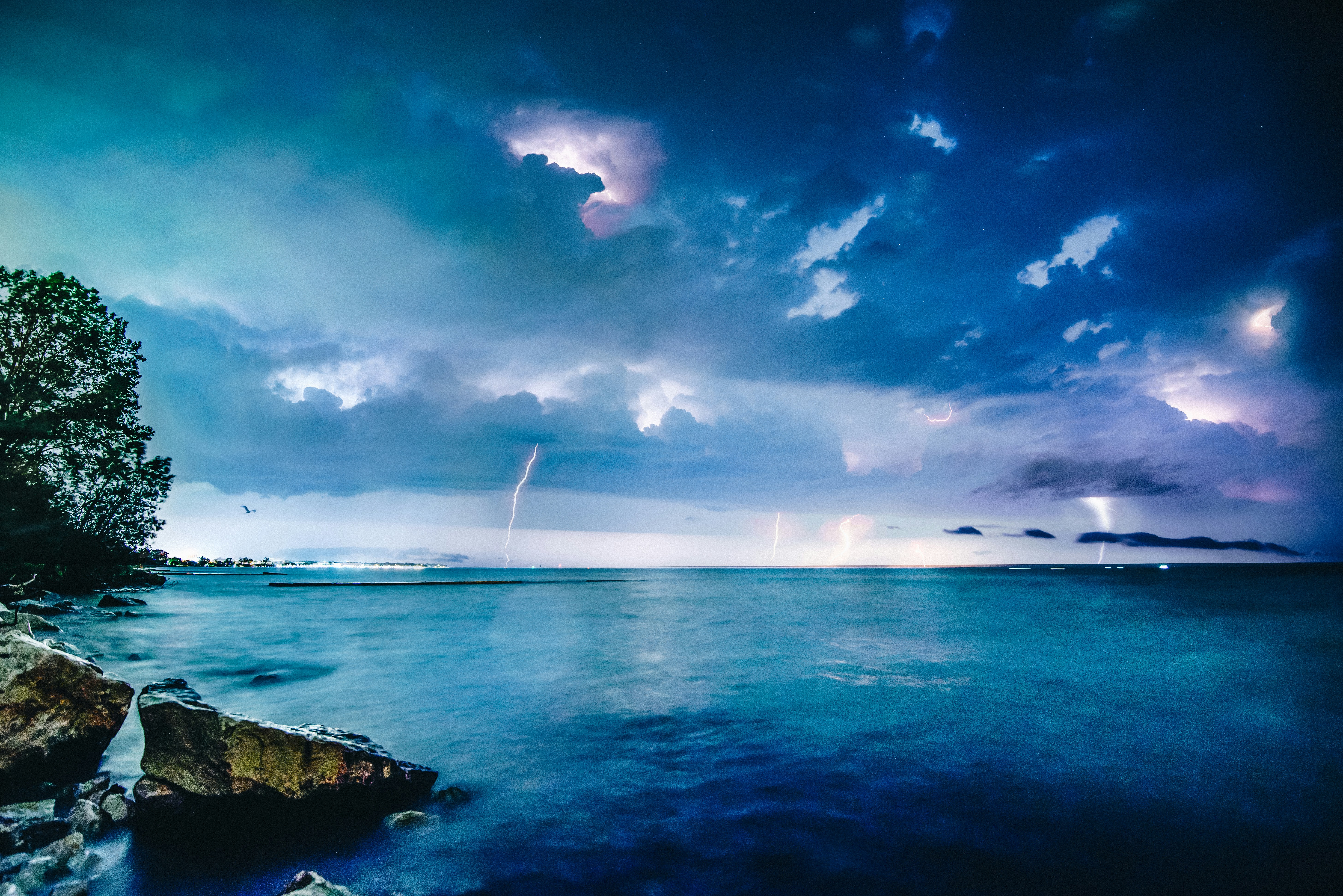 body of water under cloudy sky