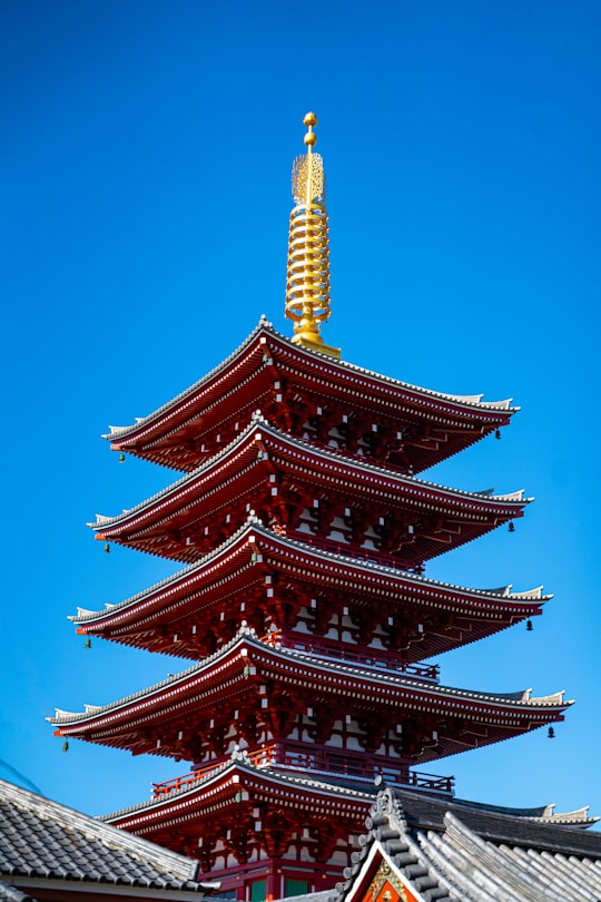 red pagoda temple during daytime in Sensō-ji Japan