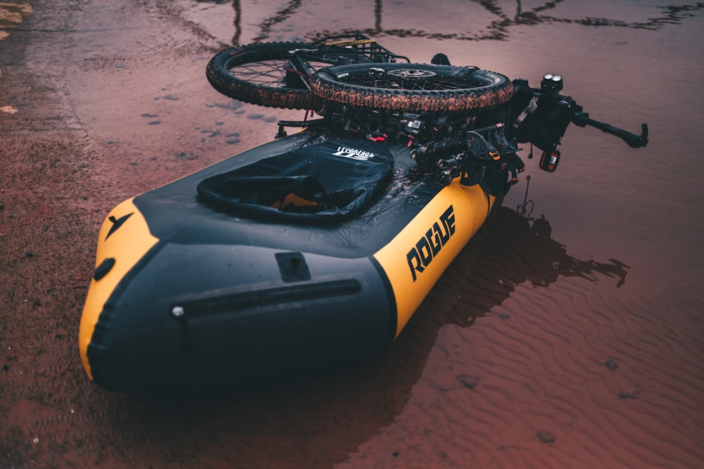 yellow and black Rogue inflatable boat
