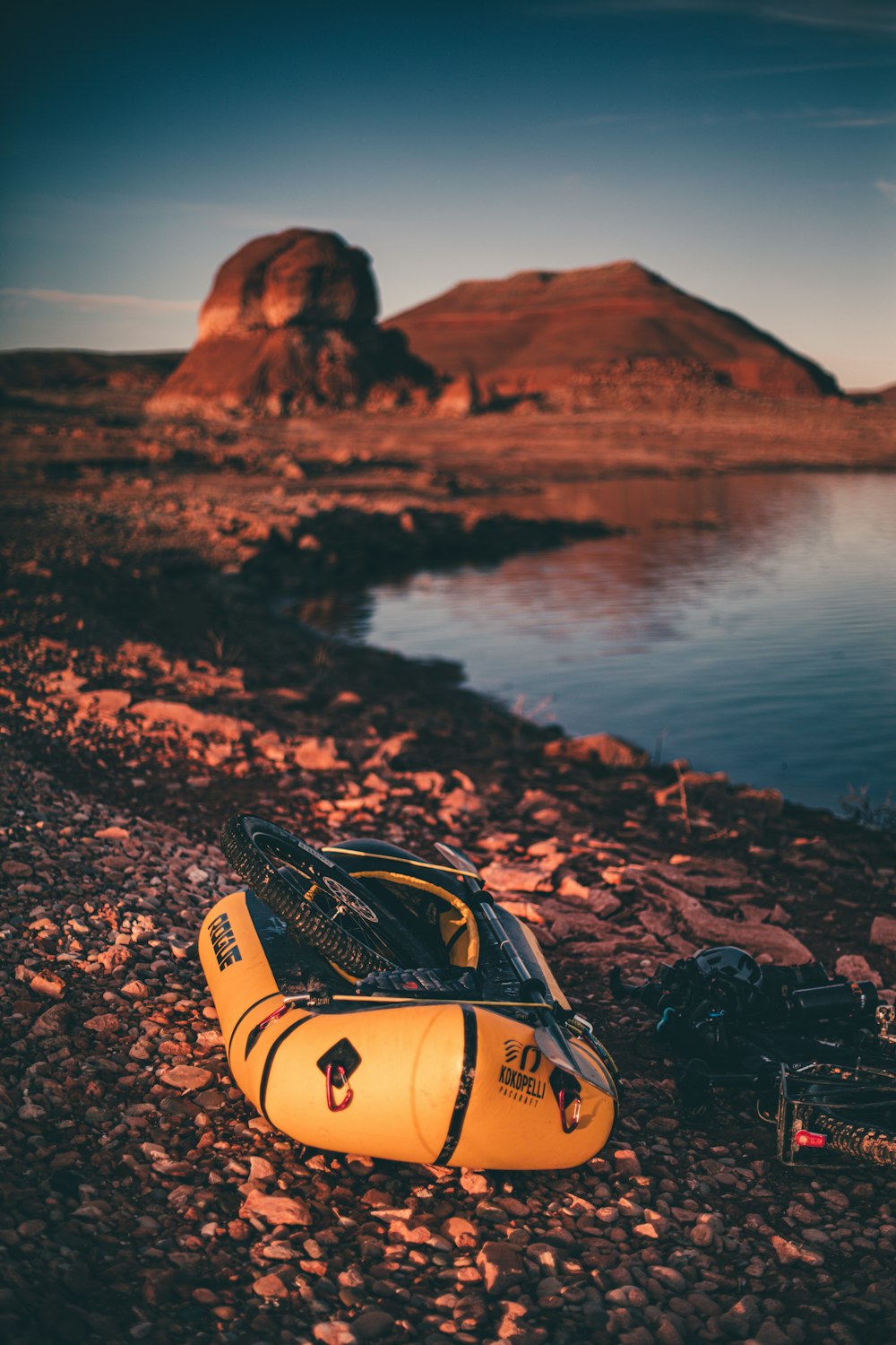 black and yellow inflatable raft near body of water