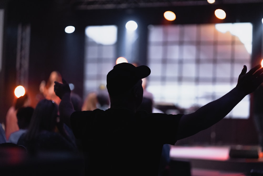 silhouette of person wearing cap