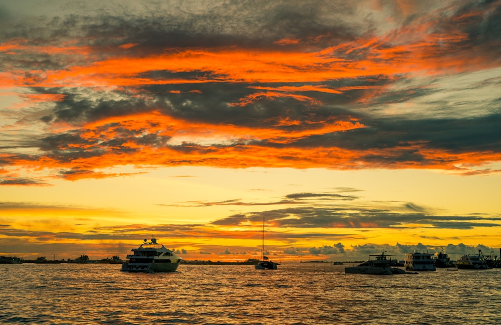 boat on sea during sunset