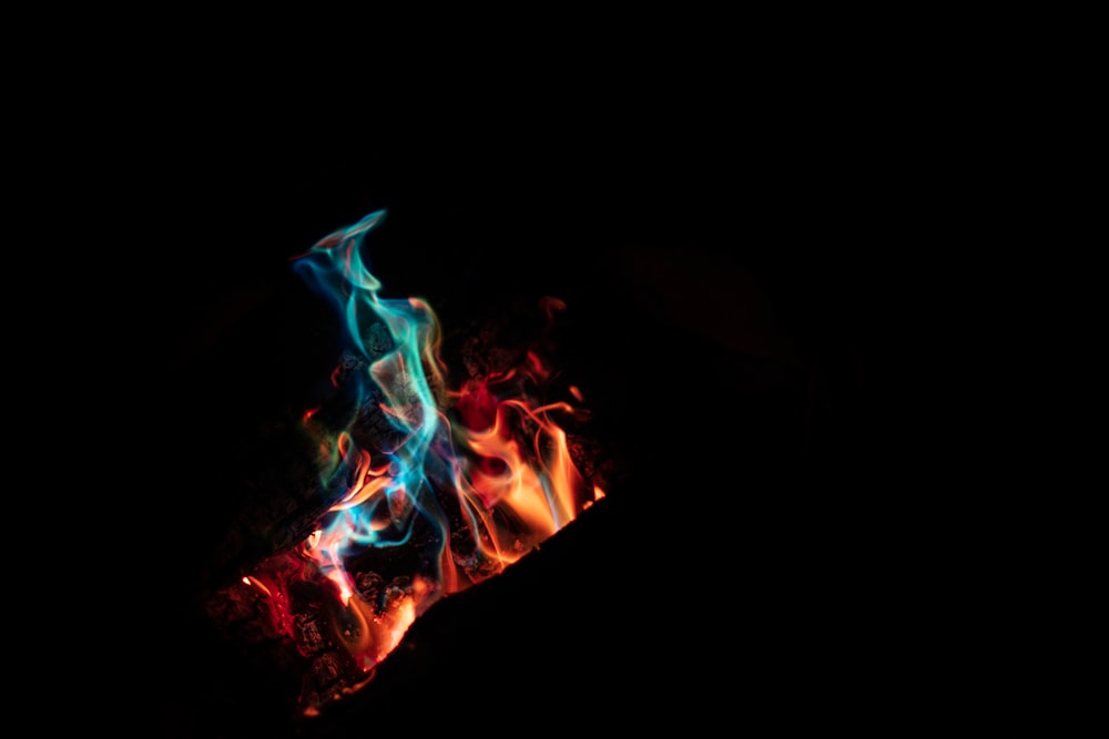 a close up of a fire in the dark