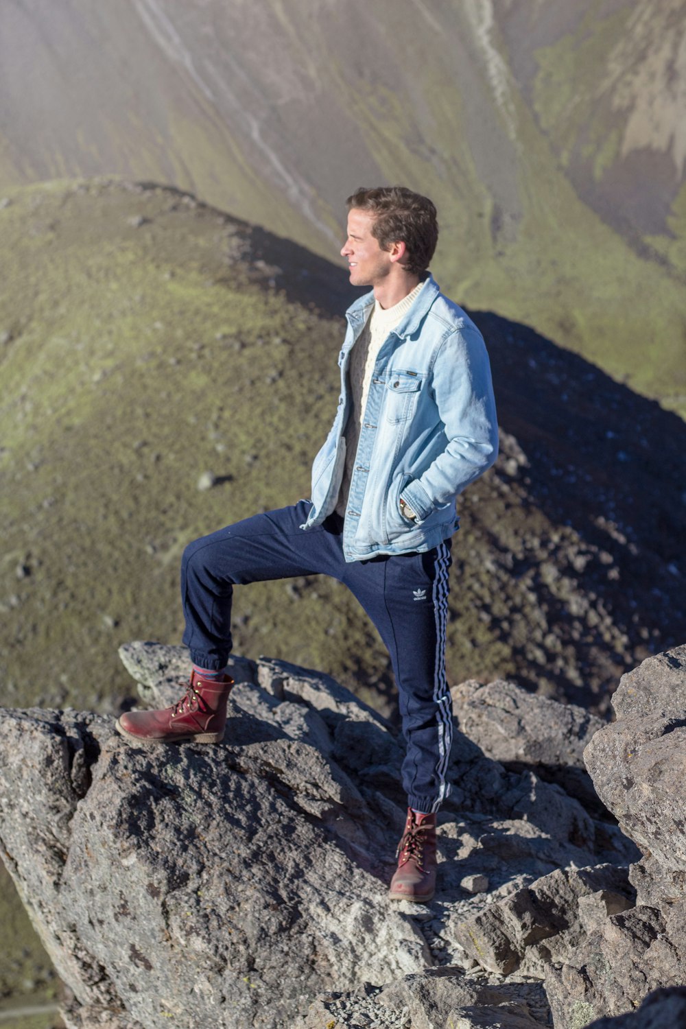 shallow focus photo of man in blue denim button-up jacket