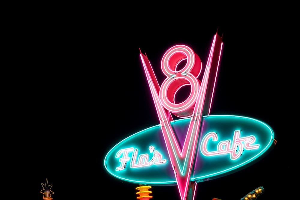 Flu's Cafe neon sign at night