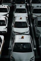 line of white vehicles