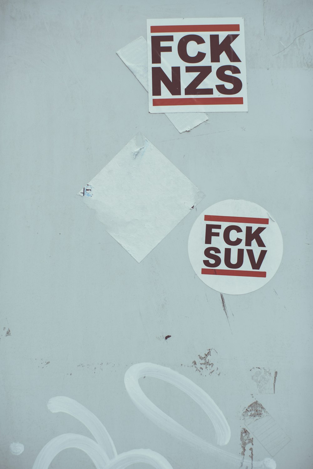 stickers on the side of a building that says fok nzs