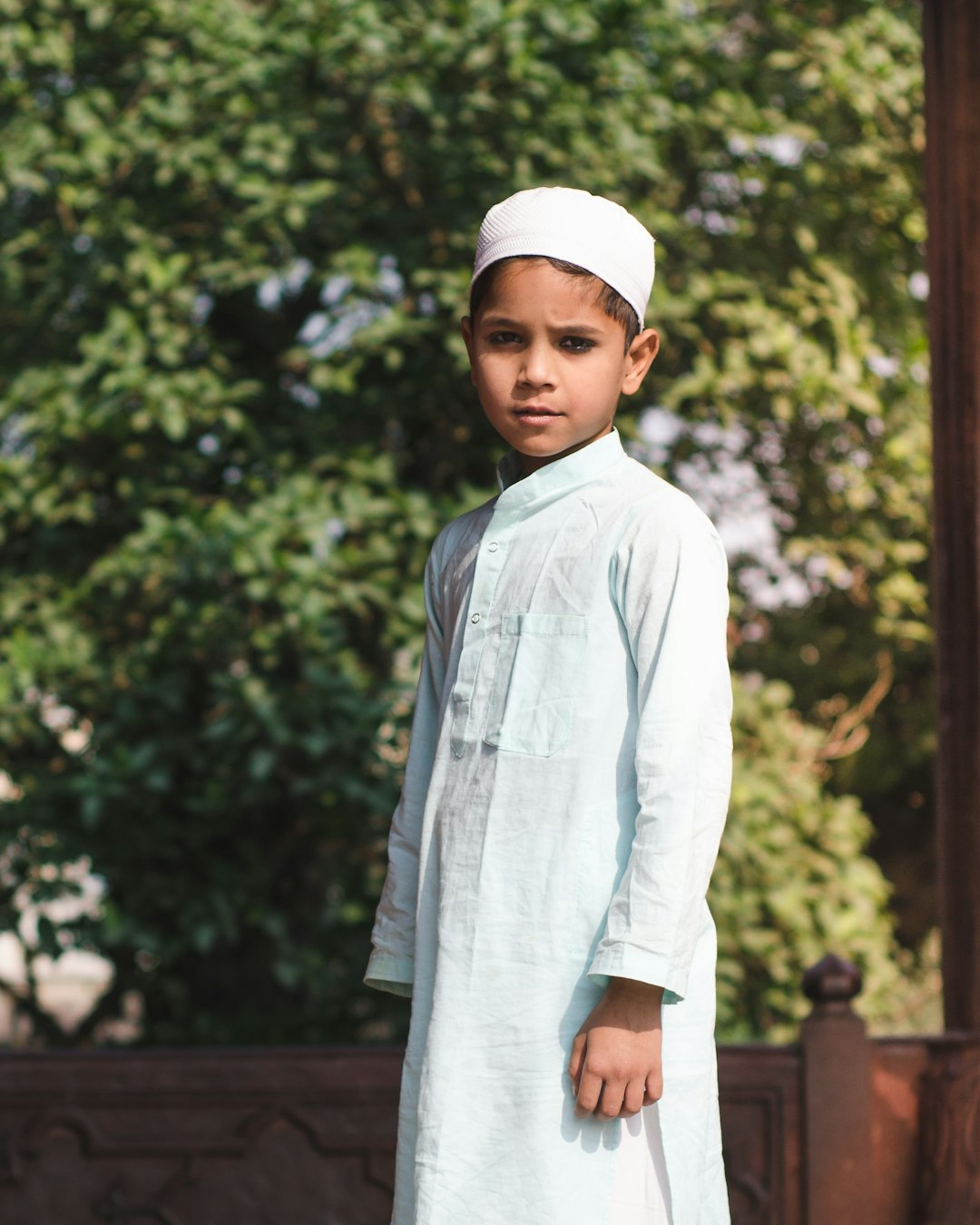 boy standing near wall