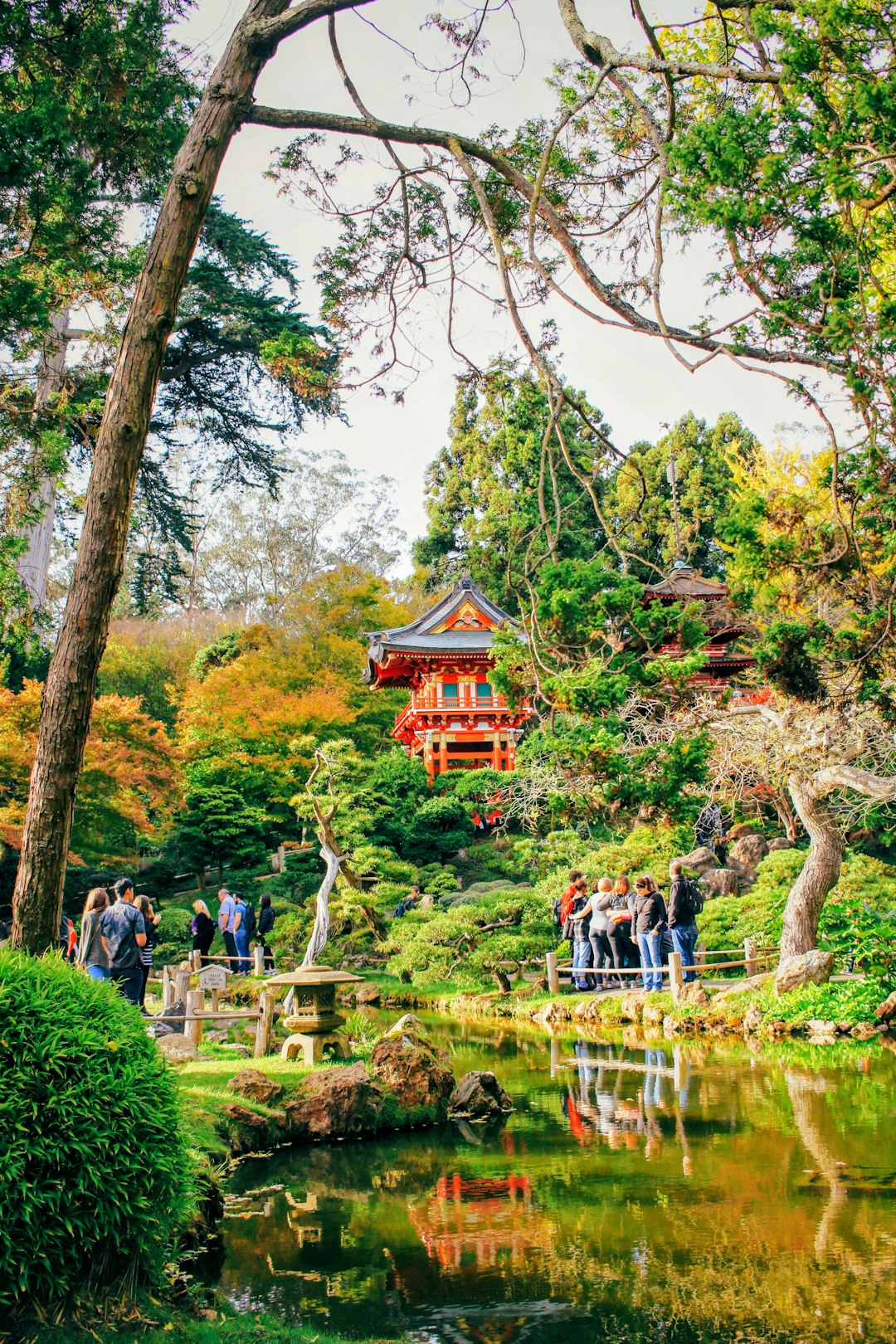 people standing beside body of water during daytime