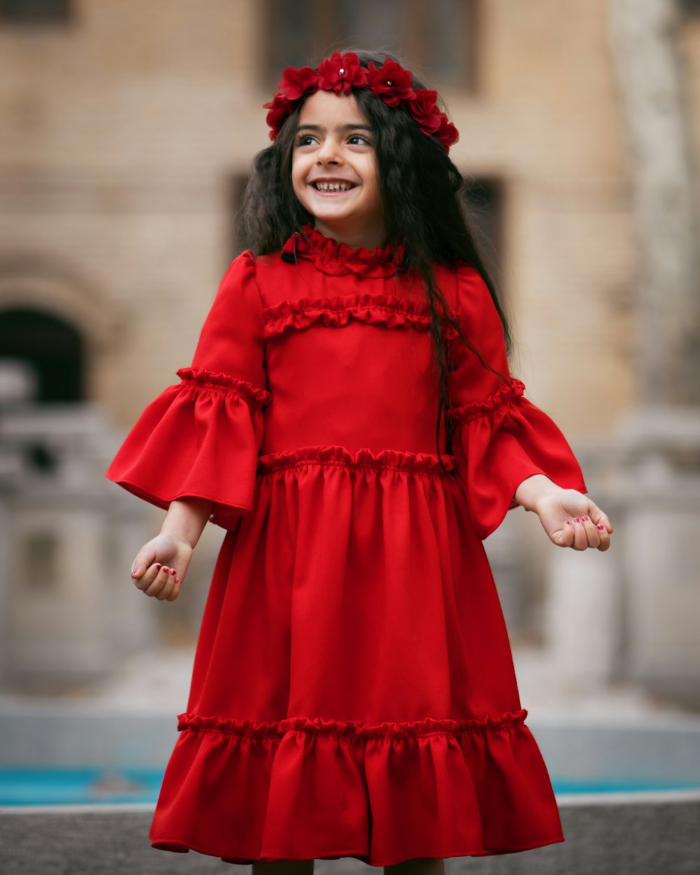 girl wearing red long-sleeved dress