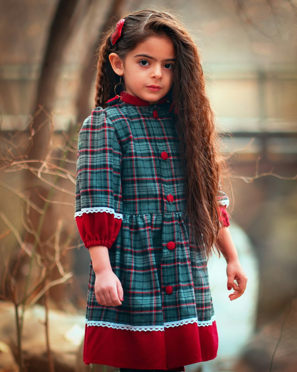 girl standing near tree