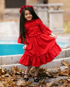 smiling girl holding her dress