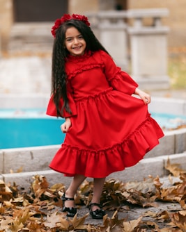 smiling girl holding her dress