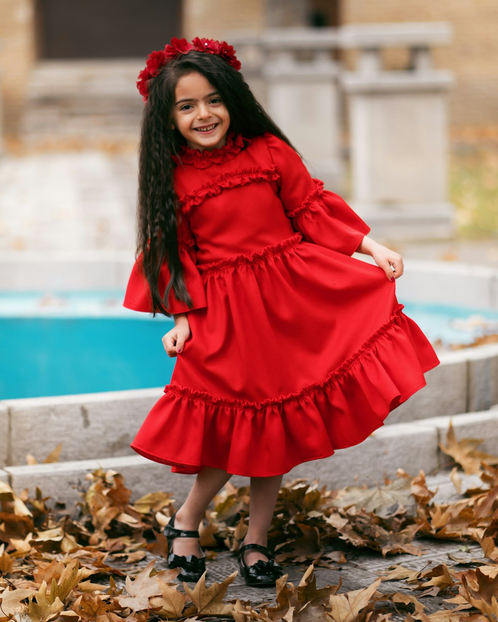 smiling girl holding her dress