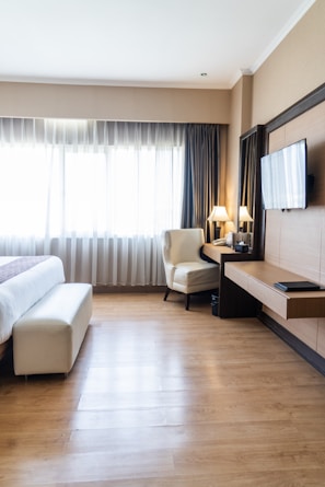 Comfortable hotel room featuring modern design and natural light.