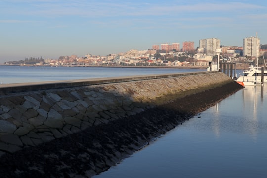 city buildings near body of water during daytime in São Pedro da Afurada Portugal