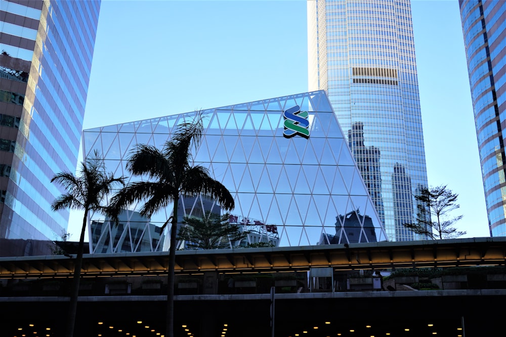 low angle photo of curtain glass wall building